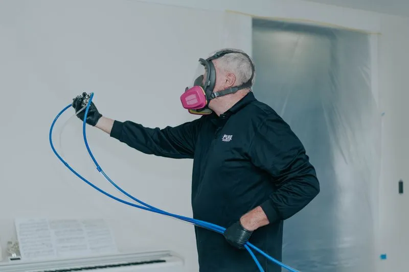 Antimicrobial protectant being applied to a treated surface